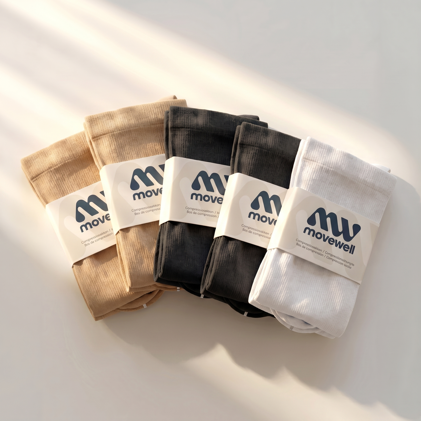 MoveWell compressiekousen 5-pack mix — twee zwart, twee huidskleur, één wit